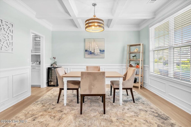 1233 Lt Congleton Rd, Wilmington, NC 28409 - dining area featuring light wood-style flooring, beam ceiling, coffered ceiling, a chandelier, and a decorative wall