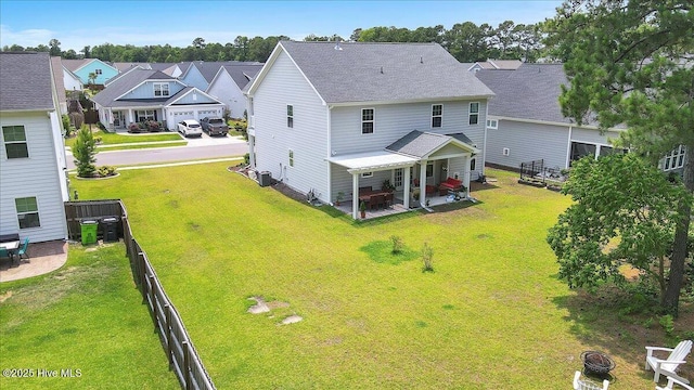 1233 Lt Congleton Rd, Wilmington, NC 28409 - back of property with a residential view, roof with shingles, a patio, central AC, and an outdoor fire pit
