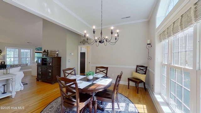 2019 Royal Pines Dr, New Bern, NC 28560 - dining space featuring light wood finished floors, a chandelier, crown molding, and baseboards