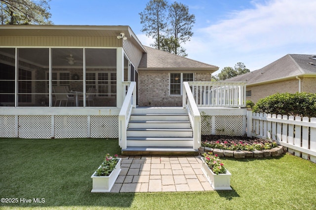 2019 Royal Pines Dr, New Bern, NC 28560 - rear view of house with a sunroom, brick siding, a deck, stairway, and ceiling fan