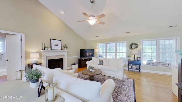 2019 Royal Pines Dr, New Bern, NC 28560 - living area featuring a fireplace, light wood finished floors, ceiling fan, high vaulted ceiling, and baseboards