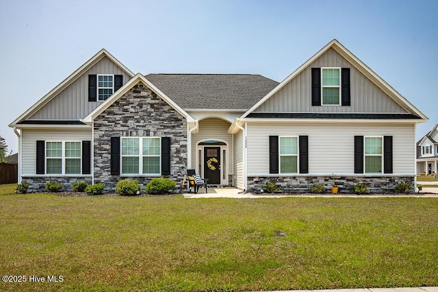 1000 Spot Cir, New Bern, NC 28562 - craftsman house featuring stone siding, board and batten siding, and a front lawn