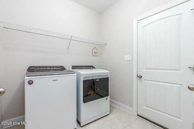 1000 Spot Cir, New Bern, NC 28562 - laundry area featuring washing machine and dryer, baseboards, and light tile patterned flooring