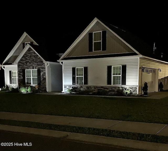 1000 Spot Cir, New Bern, NC 28562 - craftsman-style house featuring stone siding, a yard, and a garage