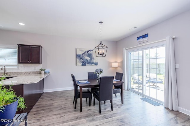 1000 Spot Cir, New Bern, NC 28562 - dining room with wood finished floors, baseboards, recessed lighting, and a chandelier