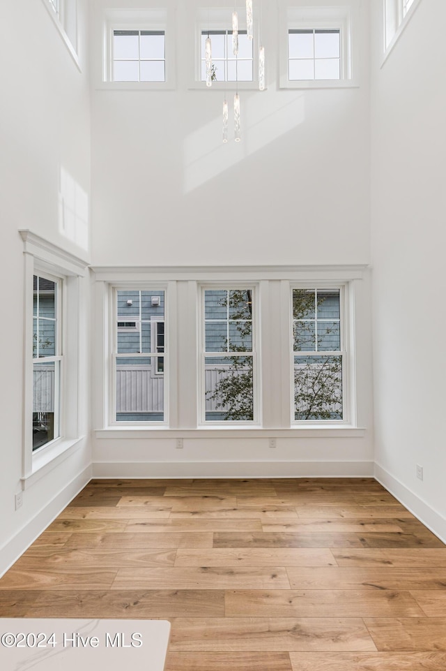 1605 E Oak Island Dr, Oak Island, NC 28465 - unfurnished sunroom featuring a chandelier and healthy amount of natural light