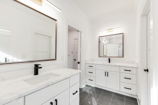 1605 E Oak Island Dr, Oak Island, NC 28465 - bathroom featuring two vanities, crown molding, and tile patterned floors