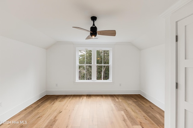 1605 E Oak Island Dr, Oak Island, NC 28465 - additional living space with lofted ceiling, baseboards, a ceiling fan, and light wood-type flooring