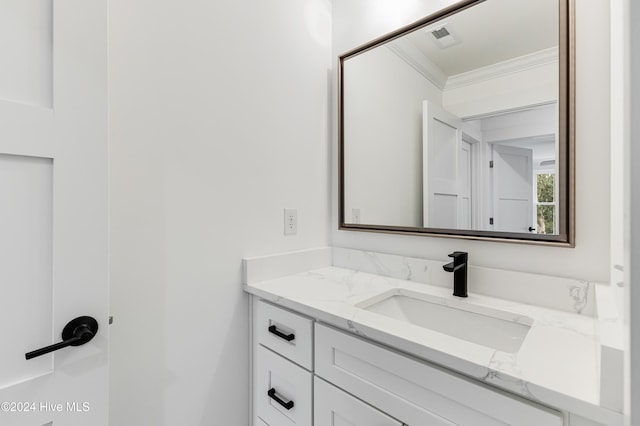 1605 E Oak Island Dr, Oak Island, NC 28465 - bathroom with vanity and ornamental molding