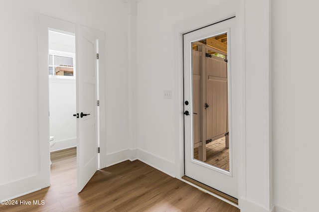 1605 E Oak Island Dr, Oak Island, NC 28465 - doorway to outside with wood finished floors