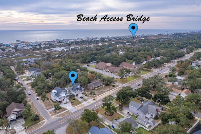 1605 E Oak Island Dr, Oak Island, NC 28465 - aerial perspective of suburban area with a nearby body of water
