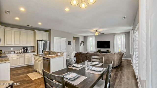 284 Old Swamp Rd, South Mills, NC 27976 - dining room featuring baseboards, a chandelier, dark wood-style flooring, and recessed lighting