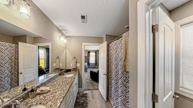 284 Old Swamp Rd, South Mills, NC 27976 - full bath featuring vanity, wood finished floors, and baseboards