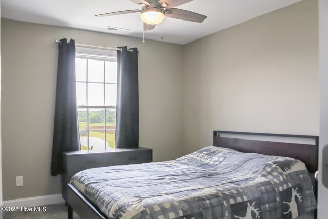 284 Old Swamp Rd, South Mills, NC 27976 - carpeted bedroom featuring baseboards and ceiling fan