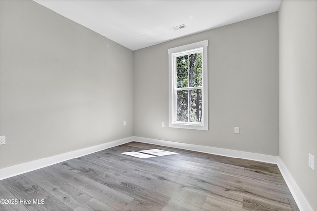 340 Persimmon Rd SW, Calabash, NC 28467 - unfurnished room featuring wood finished floors and baseboards