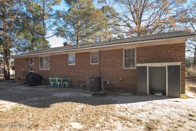 10179 NC Highway 305, Jackson, NC 27845 - back of property featuring brick siding, a chimney, crawl space, and central air condition unit
