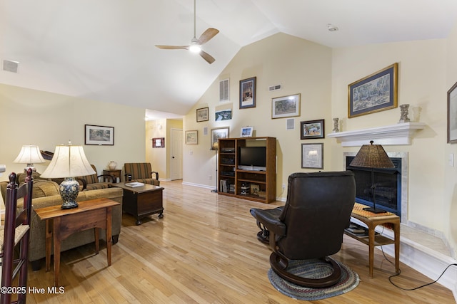 3863 Daphine Ct, Wilmington, NC 28409 - living area with ceiling fan, light wood-type flooring, a fireplace, high vaulted ceiling, and baseboards