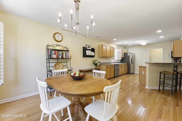 3863 Daphine Ct, Wilmington, NC 28409 - dining room featuring light wood-style flooring, baseboards, a chandelier, and recessed lighting