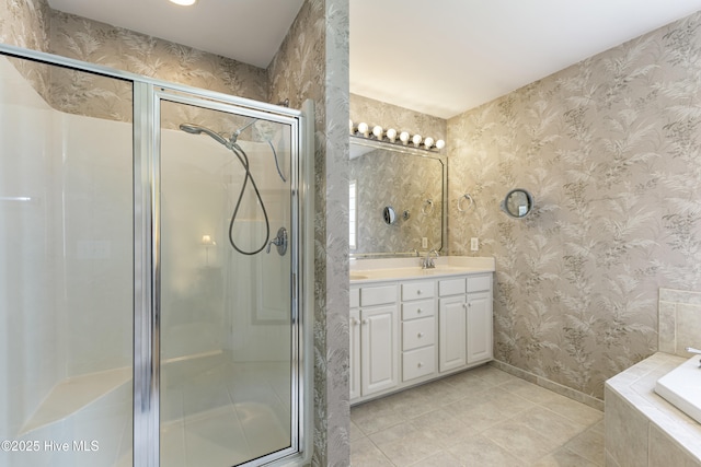3863 Daphine Ct, Wilmington, NC 28409 - bathroom featuring tile patterned floors, double vanity, a shower stall, and a bath