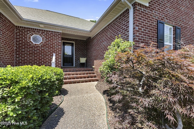3863 Daphine Ct, Wilmington, NC 28409 - doorway to property featuring brick siding and roof with shingles