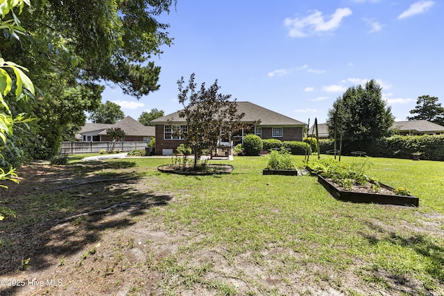 3863 Daphine Ct, Wilmington, NC 28409 - view of yard featuring a vegetable garden