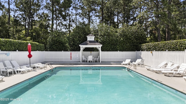 3863 Daphine Ct, Wilmington, NC 28409 - community pool featuring a gazebo, a patio, and view of scattered trees