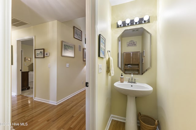 3863 Daphine Ct, Wilmington, NC 28409 - bathroom featuring wood finished floors and baseboards
