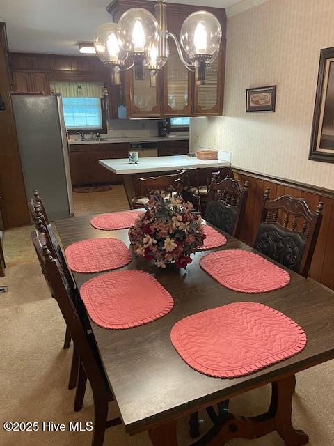 7584 County Home Rd, Ayden, NC 28513 - dining space featuring a chandelier, wallpapered walls, and light colored carpet
