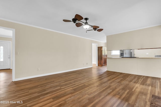 214 Frink Dr, Southport, NC 28461 - unfurnished living room featuring ornamental molding, wood finished floors, a ceiling fan, and baseboards