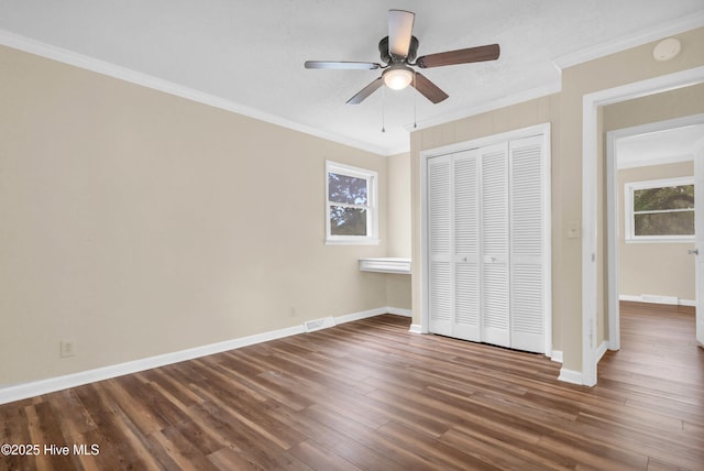 214 Frink Dr, Southport, NC 28461 - unfurnished bedroom with a closet, wood finished floors, ornamental molding, baseboards, and ceiling fan