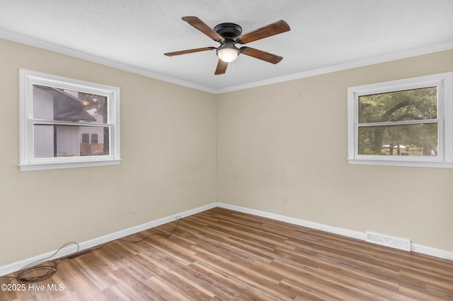 214 Frink Dr, Southport, NC 28461 - empty room featuring wood finished floors, a ceiling fan, crown molding, and baseboards