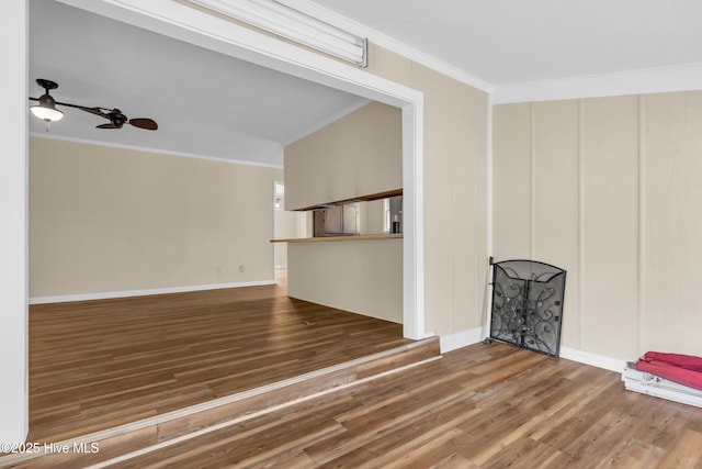 214 Frink Dr, Southport, NC 28461 - unfurnished living room with crown molding, wood finished floors, and baseboards