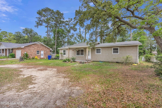 214 Frink Dr, Southport, NC 28461 - ranch-style house featuring a front lawn
