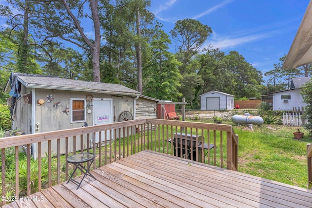 214 Frink Dr, Southport, NC 28461 - wooden terrace featuring a detached garage and an outdoor structure