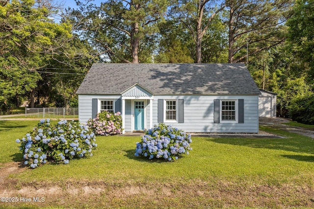 207 Battleground Ave, New Bern, NC 28560 - new england style home with roof with shingles and an outbuilding