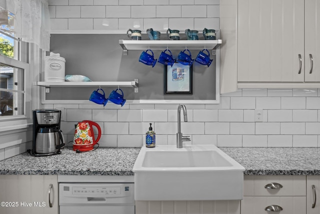 207 Battleground Ave, New Bern, NC 28560 - kitchen with white dishwasher, open shelves, and decorative backsplash