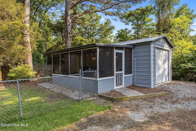 207 Battleground Ave, New Bern, NC 28560 - view of property exterior featuring a sunroom and a metal roof