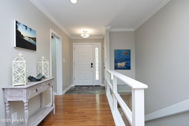 467 Longleaf Dr, West End, NC 27376 - entryway featuring ornamental molding, wood finished floors, and baseboards