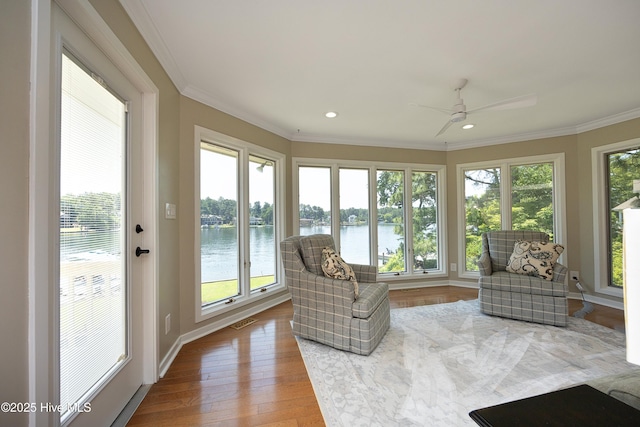 467 Longleaf Dr, West End, NC 27376 - sunroom / solarium featuring a water view, crown molding, wood finished floors, recessed lighting, and baseboards