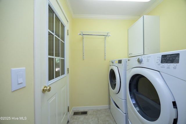 467 Longleaf Dr, West End, NC 27376 - laundry area with washer and dryer, ornamental molding, baseboards, cabinet space, and light tile patterned floors