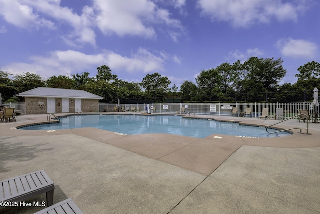 6003 Mount Carmel Parke, Wilmington, NC 28412 - community pool featuring a patio