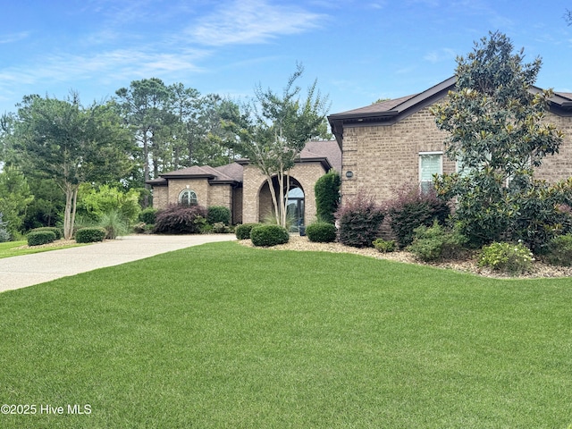 6003 Mount Carmel Parke, Wilmington, NC 28412 - view of front of property featuring a front yard and brick siding