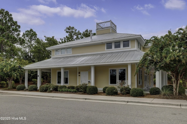 6003 Mount Carmel Parke, Wilmington, NC 28412 - farmhouse featuring covered porch, metal roof, and a chimney