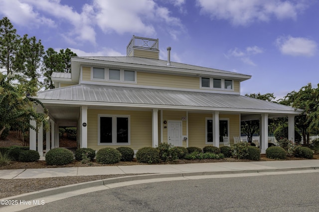 6003 Mount Carmel Parke, Wilmington, NC 28412 - farmhouse featuring a porch and metal roof