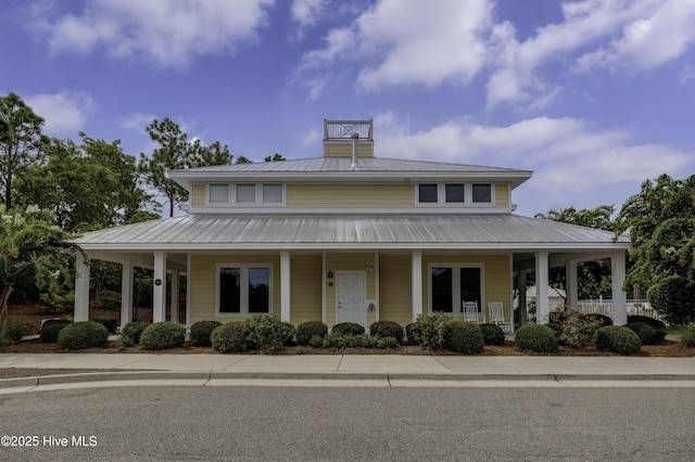 6003 Mount Carmel Parke, Wilmington, NC 28412 - farmhouse inspired home featuring a porch and metal roof