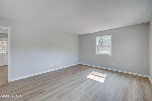 326 Cathay Rd, Wilmington, NC 28412 - unfurnished room with plenty of natural light, baseboards, and wood finished floors