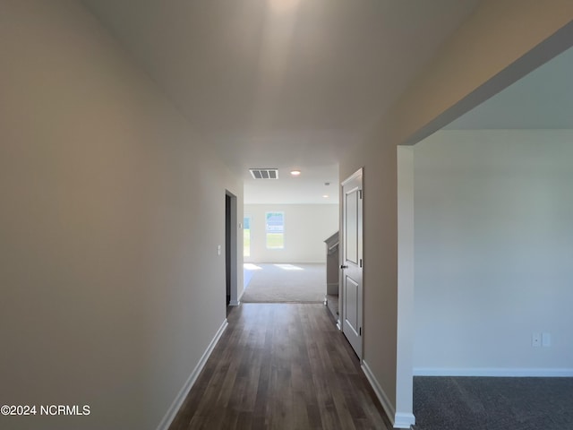 210 Presley St, Raeford, NC 28376 - hall with baseboards, dark carpet, recessed lighting, and dark wood-type flooring