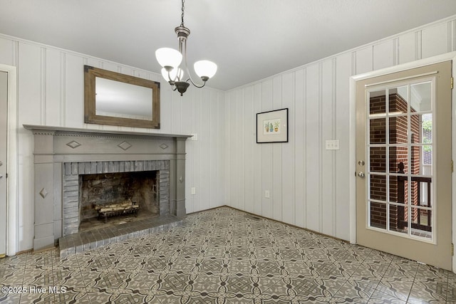 780 Leslie Campbell Ave, Lillington, NC 27546 - unfurnished living room with a decorative wall, a brick fireplace, and a chandelier