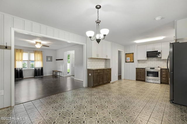 780 Leslie Campbell Ave, Lillington, NC 27546 - kitchen with appliances with stainless steel finishes, tasteful backsplash, white cabinets, and light countertops
