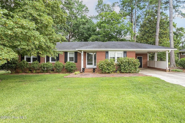 780 Leslie Campbell Ave, Lillington, NC 27546 - ranch-style home with entry steps, a carport, brick siding, and driveway